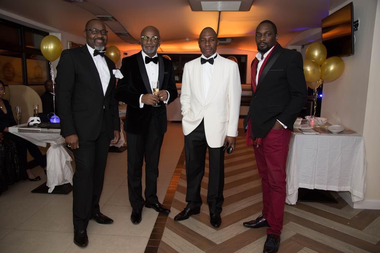 Men of Honour Consortium members at a formal black-tie gala event